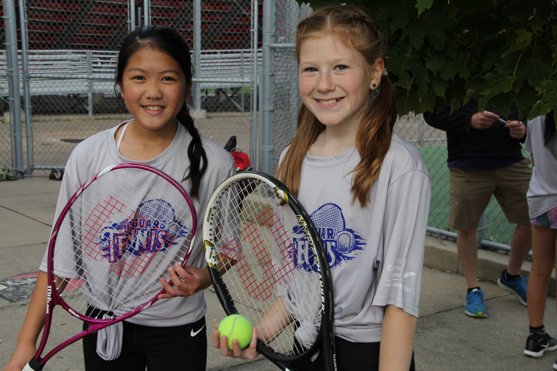 Student tennis players smile 